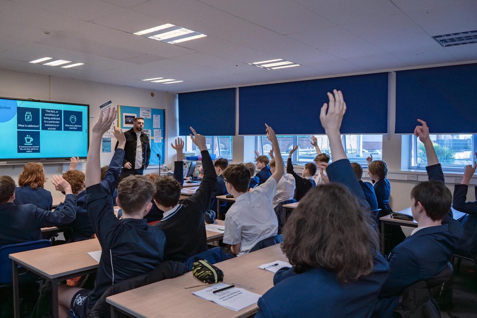 Students engaging with interactive discussion during a session
