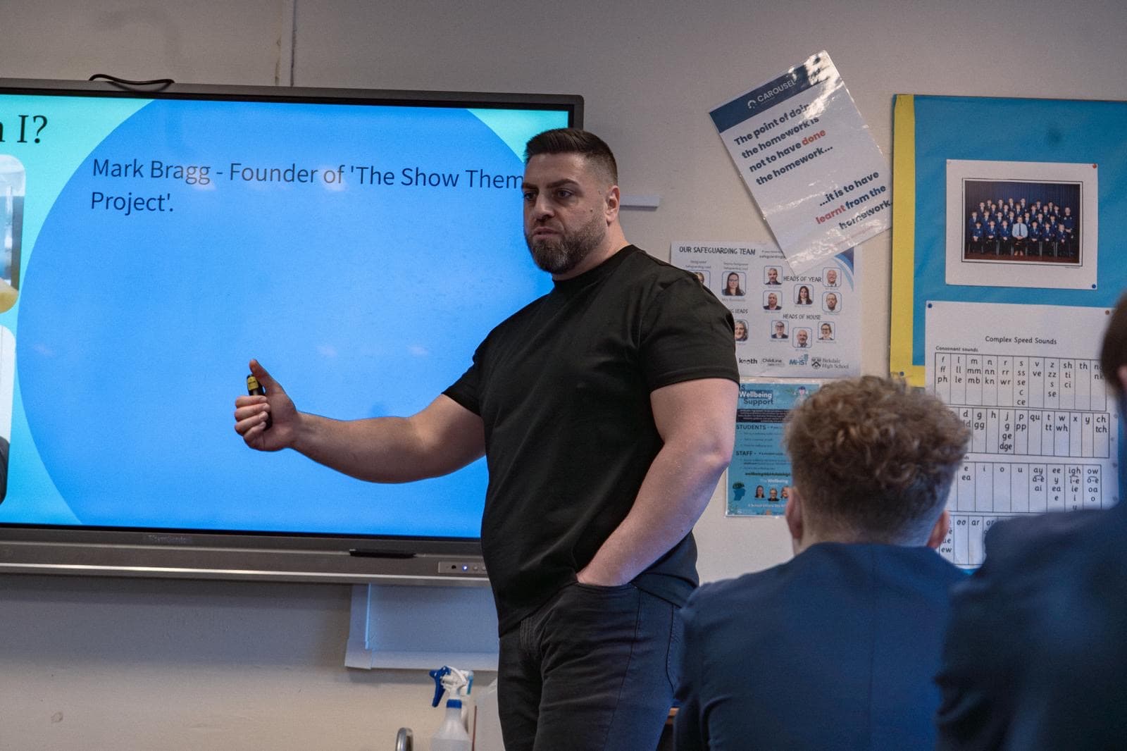 Mark presenting to students in a school session
